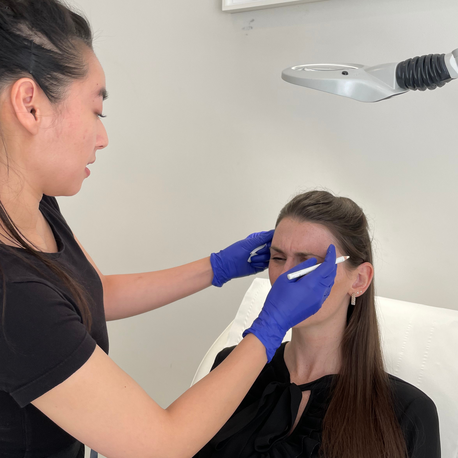 Dr Vy speaks to a client about Wrinkle Relaxing Treatments at Medicetics London